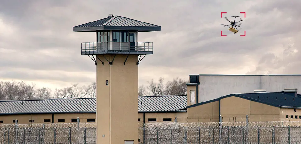 prison yard with drone in the sky